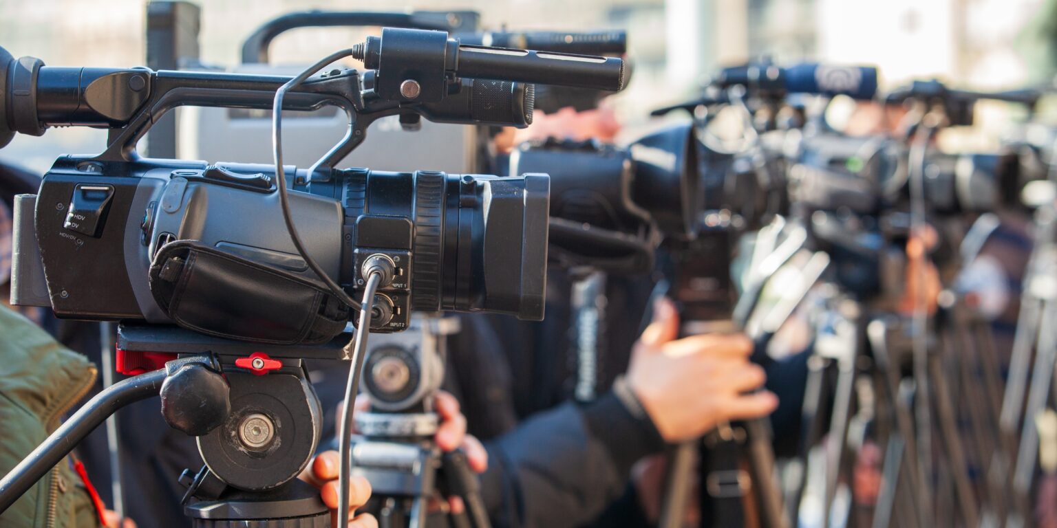 Media crew using professional video cameras as part of communication solutions in modern broadcasting