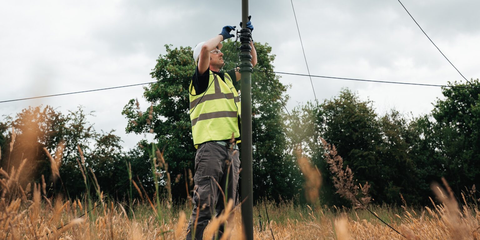 An SMC employee conducting remote mast deployment